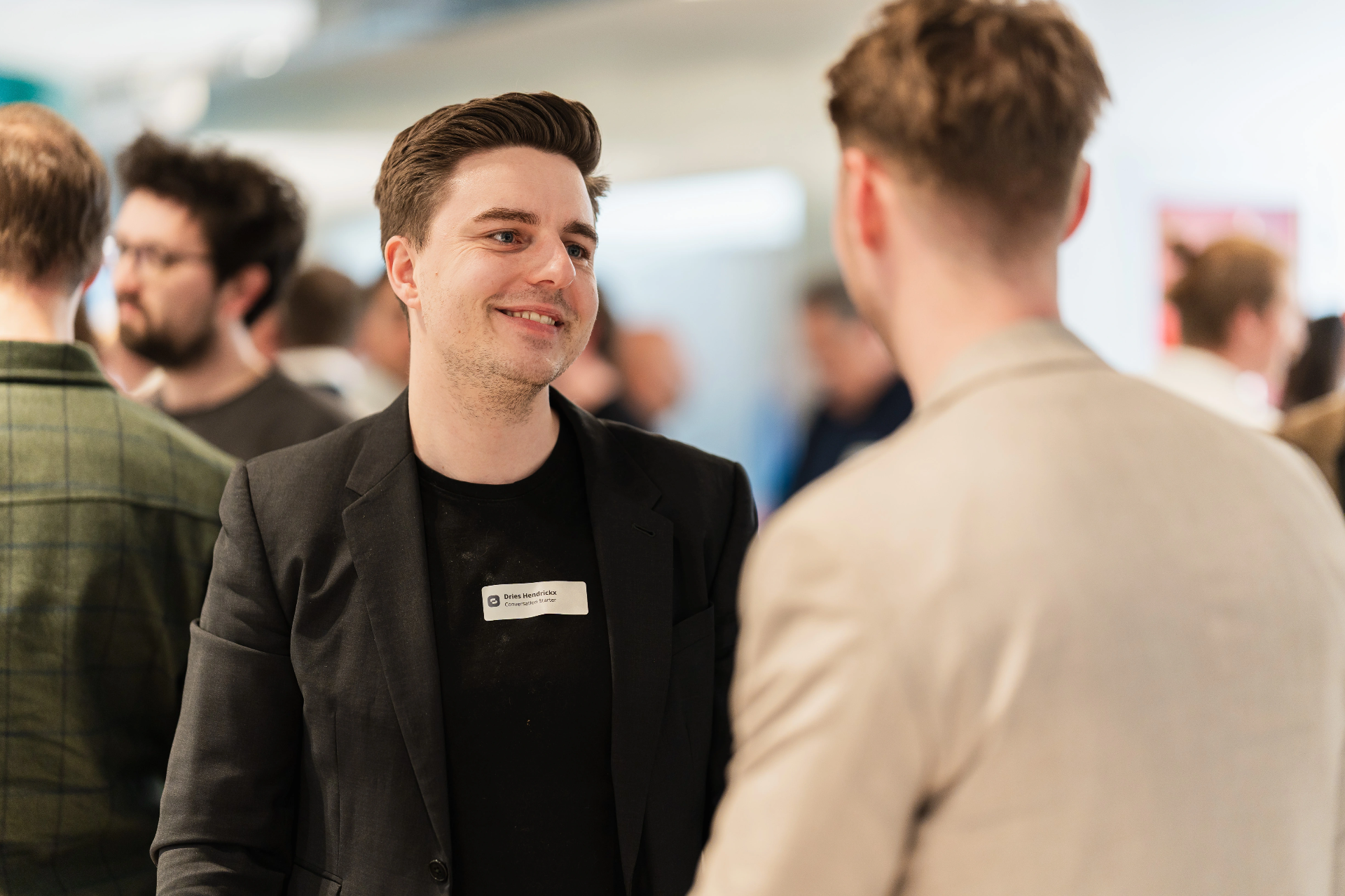 Professionals continuing an event conversation
